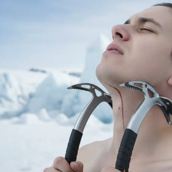 Ice picks hanging on a short cord over a jacket chest