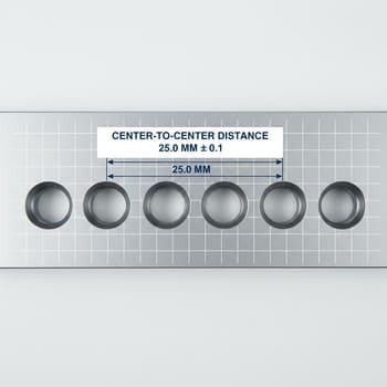 Top view of evenly spaced ice holes forming a clean pattern