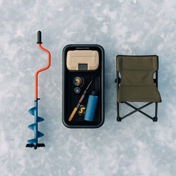 Single angler pulling a compact sled with shelter and auger along a marked night ice lane